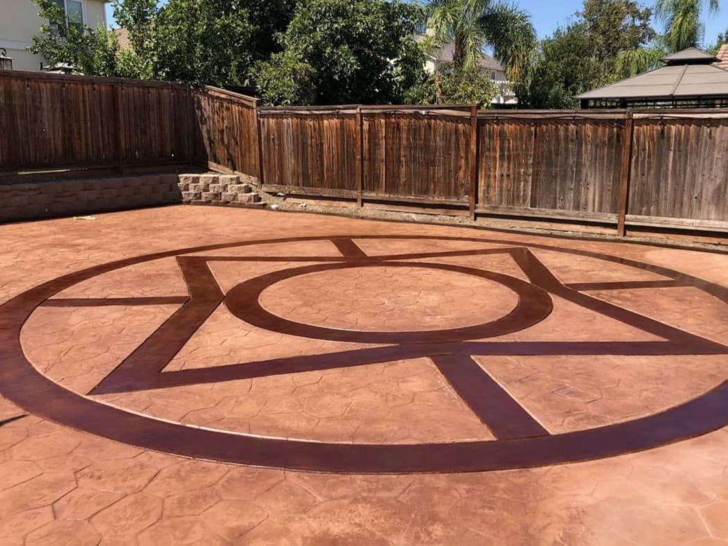 Brown and maroon concrete pavers and new concrete driveway